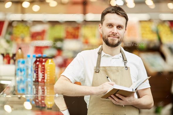 Supermarket Worker looking at Camera